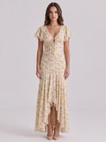Brisconti Portofino Maxikleid in Beige mit Blumenprint, V-Ausschnitt, Spitzenbesatz und asymmetrischem Saum.